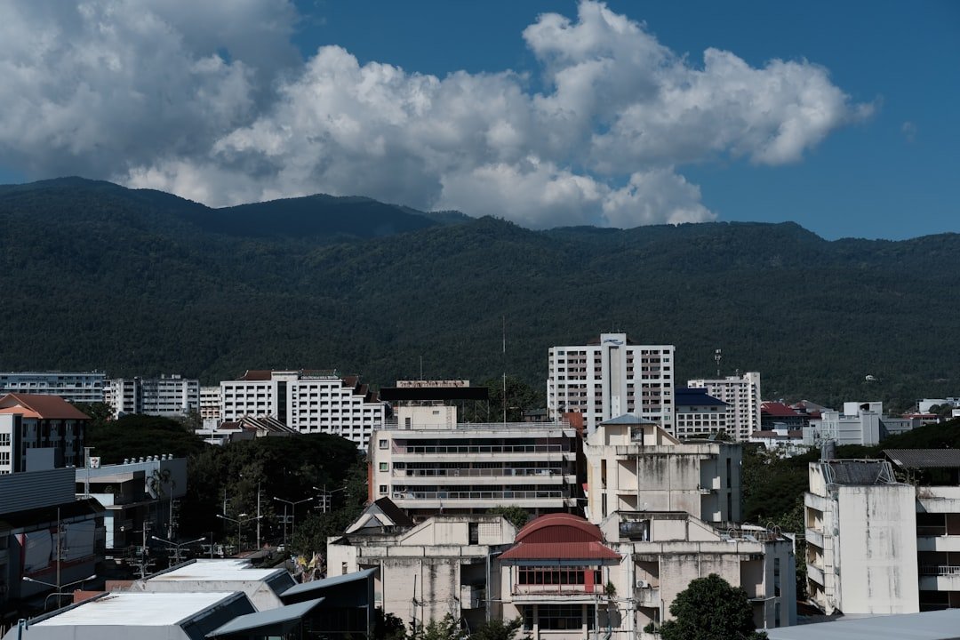 Panoramic view from Doi Suthep overlooking Chiang Mai city with mountains in the background